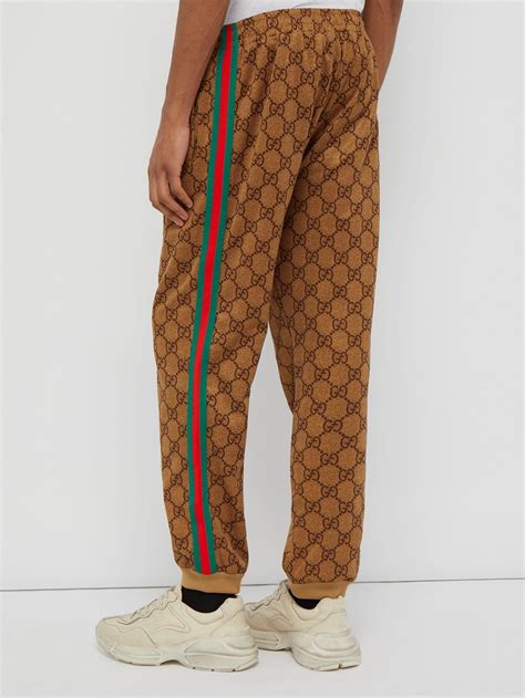 gucci gg supreme track pants|gucci side stripe track pants.